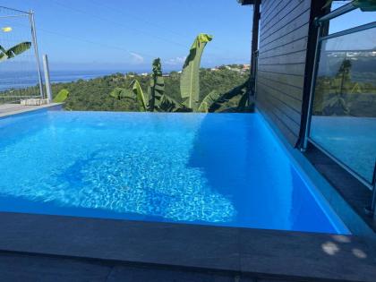 Bungalow d'une chambre avec vue sur la mer piscine partagee et terrasse a Marigot Vieux Habitants a 6 km de la plage - image 6